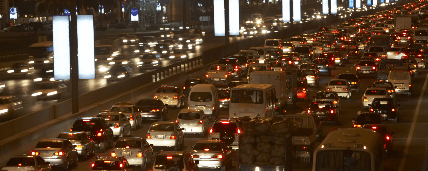 a highway filled with lots of traffic at night.