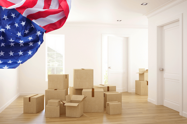 a room filled with boxes and an american flag.